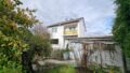 Gartenseite mit Garage